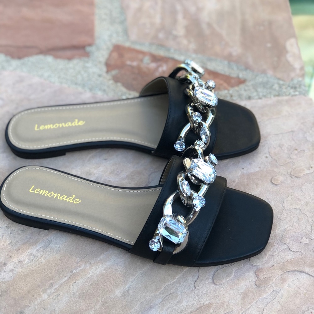 Black slides mules with chain accent